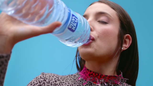 Video Reference: Hair, Face, Skin, Head, Water, Lip, Bottled water, Liquid, Drinkware, Mineral water