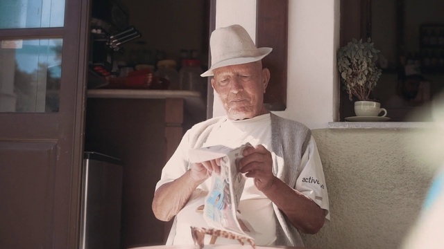 Video Reference: Hat, Flowerpot, Sun hat, Beard, Plant, Houseplant, Plastic bag, Window, Facial hair, Dress shirt