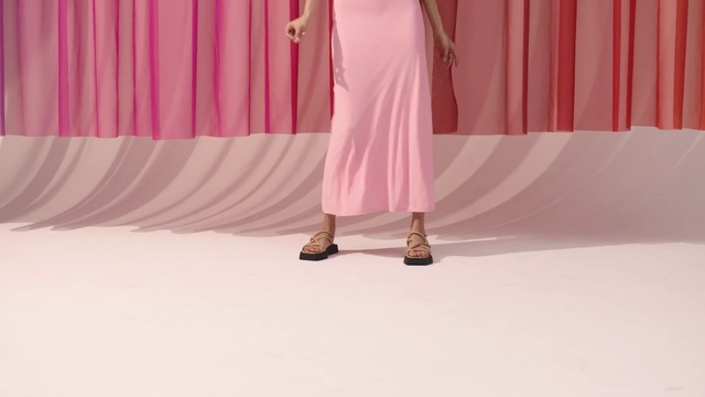 Video Reference: Sleeve, Gesture, Pink, Knee, Fashion design, Font, Magenta, Human leg, Event, Peach