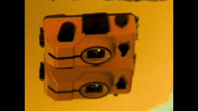 Video Reference: Rectangle, Automotive lighting, Motor vehicle, Automotive design, Toy, Camera accessory, Cameras & optics, Metal, Plastic, Font