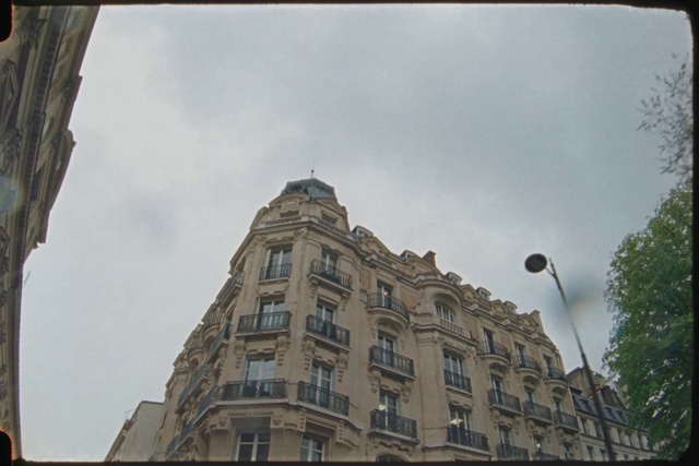 Video Reference: Cloud, Sky, Building, Daytime, Window, Lighting, Tree, Street light, Facade, City