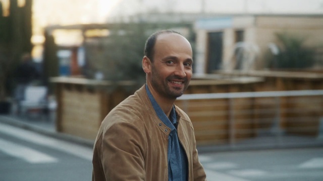 Video Reference: Smile, Beard, Dress shirt, Travel, Happy, City, White-collar worker, Facial hair, Formal wear, Road