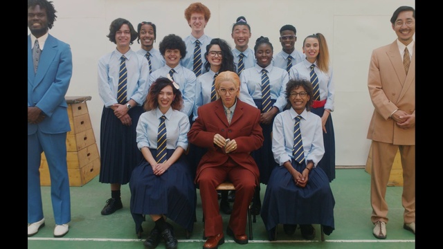 Video Reference: Trousers, Suit trousers, Smile, Coat, Tie, Suit, Blazer, Formal wear, Team, Event