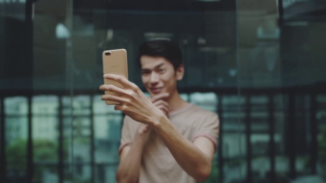 Video Reference: Mobile phone, Communication Device, Portable communications device, Gesture, Telephony, Flash photography, Thumb, Gadget, Cameras & optics, Chest