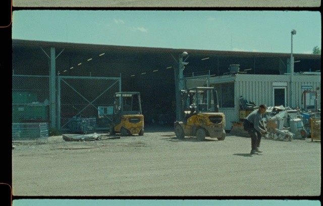 Video Reference: Wheel, Tire, Vehicle, Motor vehicle, Building, Road surface, Asphalt, Truck, Gas, Sky