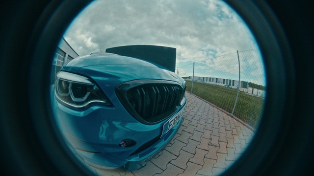 Video Reference: Cloud, Sky, Automotive lighting, Vehicle, Hood, Blue, Car, Grille, Automotive design, Azure
