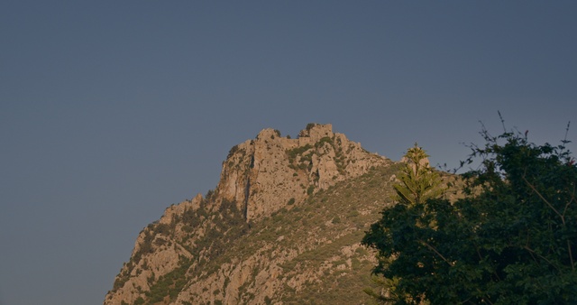 Video Reference: Sky, Mountain, Plant community, Bedrock, Natural landscape, Terrain, Tree, Landscape, Formation, Outcrop