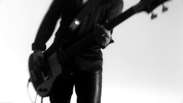 Video Reference: Neck, Sleeve, Waist, Gesture, Elbow, Musical instrument, Audio equipment, String instrument, Denim, Human leg