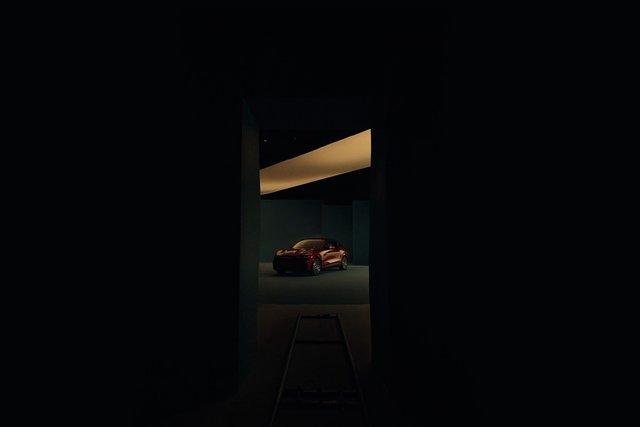 Video Reference: car, studio, red car, vehicle, dark background, lighting, minimalist, modern, indoor, automotive, showroom, spotlight, interior view, architecture, shadow, display
