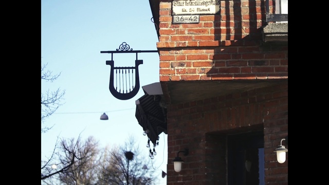 Video Reference: Sky, Lighting, Wood, Street light, Font, Lantern, Tree, Facade, Tints and shades, Window