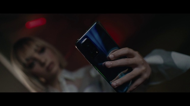 Video Reference: Communication Device, Flash photography, Gesture, Finger, Gadget, Nail, Font, Portable communications device, Automotive lighting, Electric blue