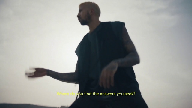 Video Reference: Shoulder, Sleeve, Gesture, Flash photography, Formal wear, Elbow, Font, Event, Sky, Backlighting