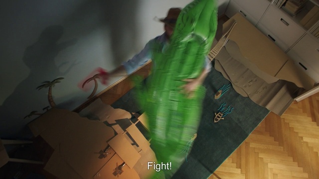 Video Reference: Wood, Art, Thigh, Flooring, Event, Human leg, Visual arts, Font, T-shirt, Room