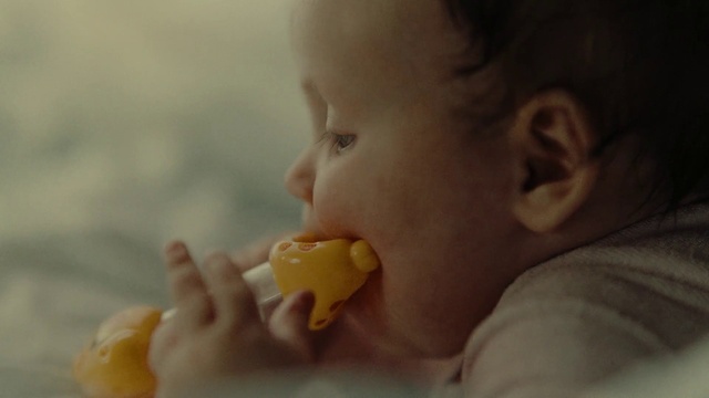 Video Reference: Nose, Cheek, Food, Ear, Orange, Gesture, Food craving, Finger, Baby grabbing for something, Baby