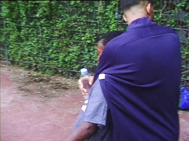 Video Reference: Plant, Sleeve, Gesture, Grass, Street fashion, Formal wear, Electric blue, Tree, Event, Soil