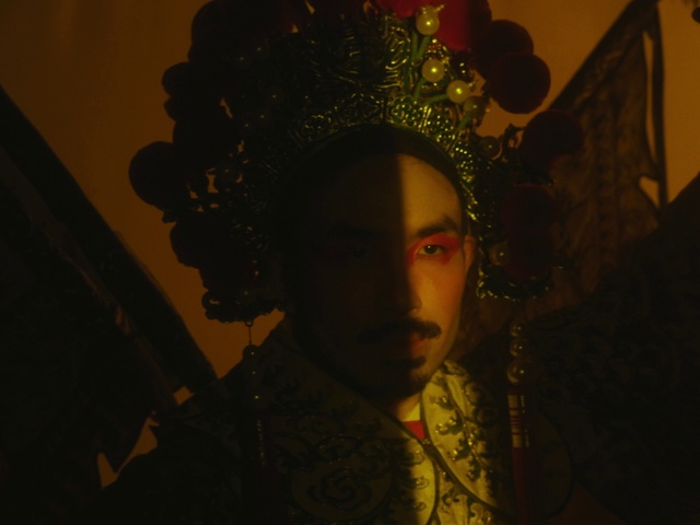 Video Reference: Art, Headgear, Tints and shades, Headpiece, Visual arts, Event, Sculpture, Darkness, Fashion accessory, Pattern