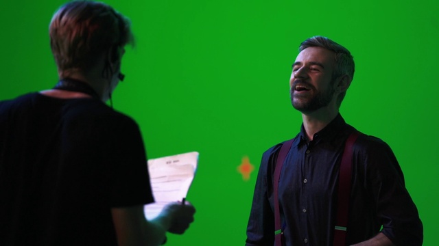 Video Reference: Shirt, Green, Standing, Gesture, Sleeve, T-shirt, Adaptation, Event, Entertainment, Conversation