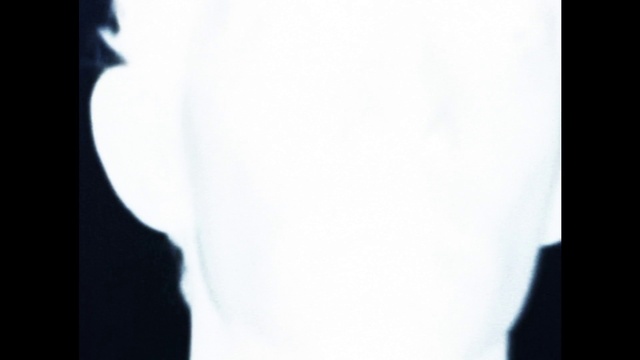 Video Reference: Sleeve, Petal, Tints and shades, Font, Darkness, Monochrome photography, Human leg, Shadow, Room, Monochrome