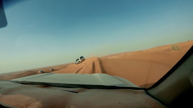 Video Reference: Sky, Vehicle, Car, Erg, Mode of transport, Travel, Landscape, Singing sand, Horizon, Dune