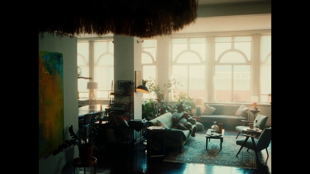 Video Reference: Window, Light, Building, Plant, Chair, Interior design, Shade, Curtain, Tints and shades, Living room