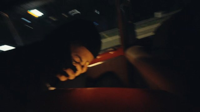 Video Reference: night, vehicle, car interior, hand, blurry, dark, close-up, motion blur, reflection, interior, low light, urban, transport