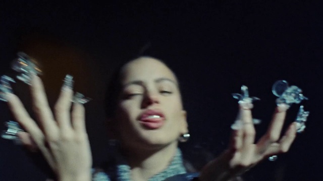 Video Reference: Lip, Hand, Musician, Flash photography, Music, Artist, Finger, Gesture, Music artist, Performing arts