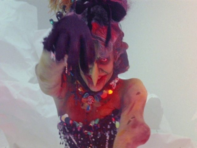Video Reference: Purple, Pink, Performing arts, Headpiece, Fashion design, Artist, Art, Entertainment, Magenta, Jewellery