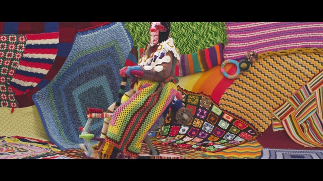 Video Reference: Hat, Couch, Entertainment, Performing arts, Pattern, Event, Tartan, Magenta, Rectangle, Art