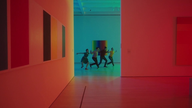 Video Reference: Orange, Art, Flooring, Magenta, Tints and shades, Event, Symmetry, Space, Electric blue, Ceiling