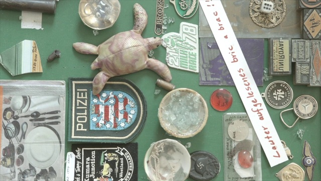 Video Reference: Souvenir, Marine invertebrates, Metal, Collection, Illustration, Saving, Font, Natural foods, Money, Cephalopod