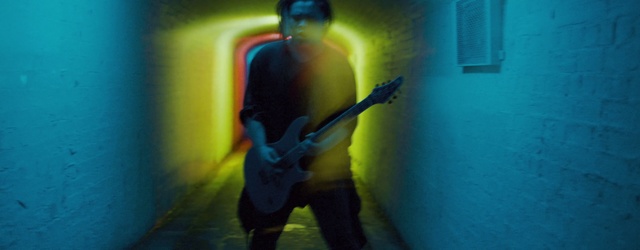 Video Reference: Musical instrument, Guitar, Blue, String instrument, Guitar accessory, Human body, Standing, String instrument accessory, Musical instrument accessory, String instrument