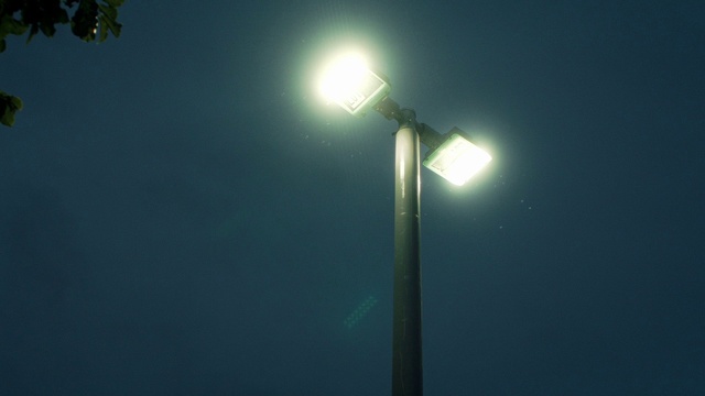Video Reference: Atmosphere, Sky, Floodlight, Street light, Electricity, Atmospheric phenomenon, Electric blue, Lens flare, Pole, Security lighting