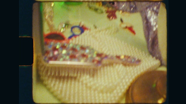 Video Reference: Rectangle, Creative arts, Art, Craft, Wood, Event, Display device, Visual arts, Fashion accessory, Stitch