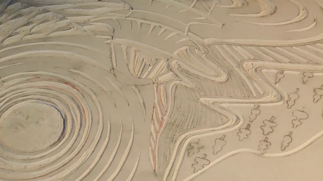 Video Reference: Wood, Pattern, Art, Landscape, Geology, Sand, Circle, Font, Natural material, Event