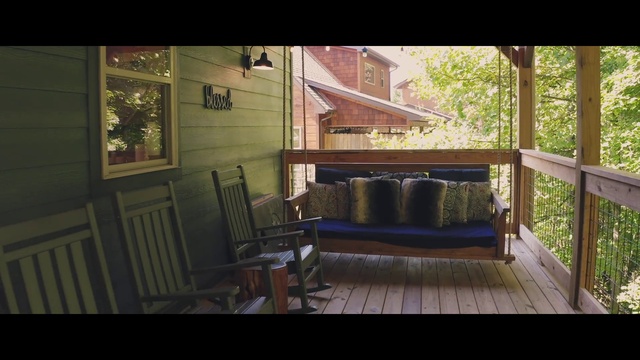 Video Reference: Window, Plant, Building, Wood, Floor, Couch, Flooring, Shade, Outdoor furniture, Chair