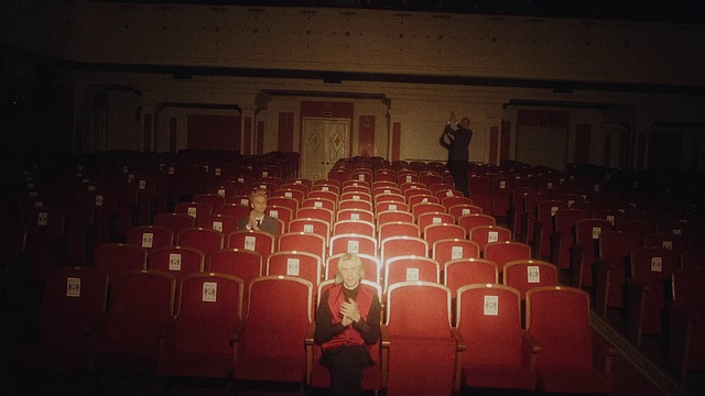 Video Reference: Entertainment, Musical instrument accessory, Event, Performing arts, Font, Chair, Darkness, Crowd, Audience, Performing arts center