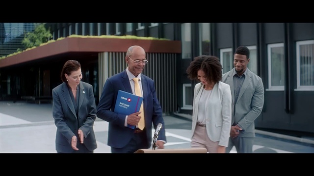 Video Reference: Gesture, Real estate, Blazer, Suit, Formal wear, Event, White-collar worker, Job, Employment, Conversation