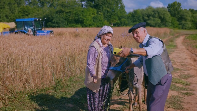 Video Reference: Face, Plant, Tree, Wheel, Grass, People in nature, Tire, Agriculture, Grassland, Cap
