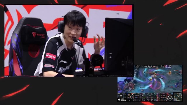Video Reference: esports, gamer, gaming chair, headset, computer monitor, live broadcast, competition, gameplay, team jersey, commentary, tournament, screen capture, player, indoor, video game, broadcast overlay