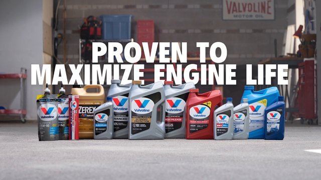 Video Reference: garage, automotive, engine oil, motor oil, car fluids, product lineup, containers, workshop, advertisement, text overlay, Valvoline, maintenance, lubricant, auto care