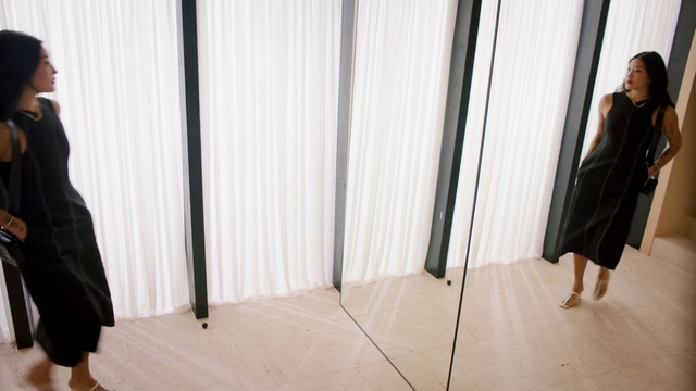 Video Reference: Joint, Outerwear, Shoulder, Black, Floor, Wood, Flooring, Curtain, Formal wear, Street fashion