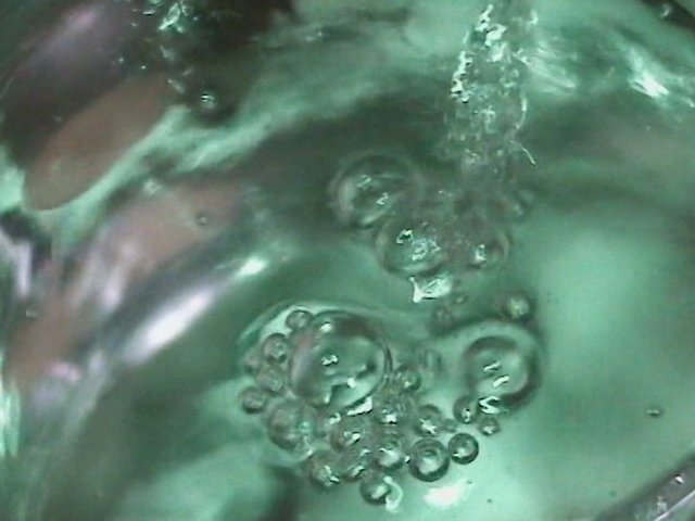 Video Reference: liquid, bubbles, close-up, abstract, green, swirl, texture, fluid, macro, motion