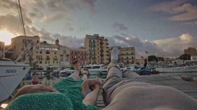 Video Reference: Cloud, Sky, Water, Building, Window, Leg, Azure, Human body, Gesture, Travel