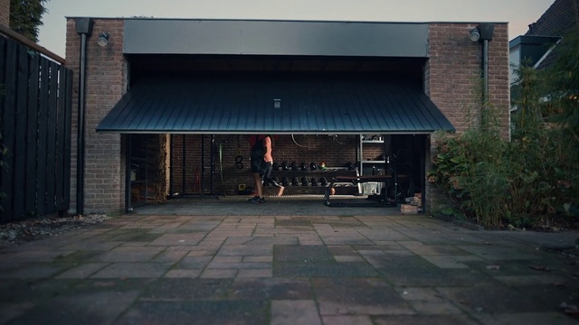 Video Reference: Plant, Road surface, Asphalt, Shade, Wood, Gas, Tints and shades, Facade, City, Sidewalk