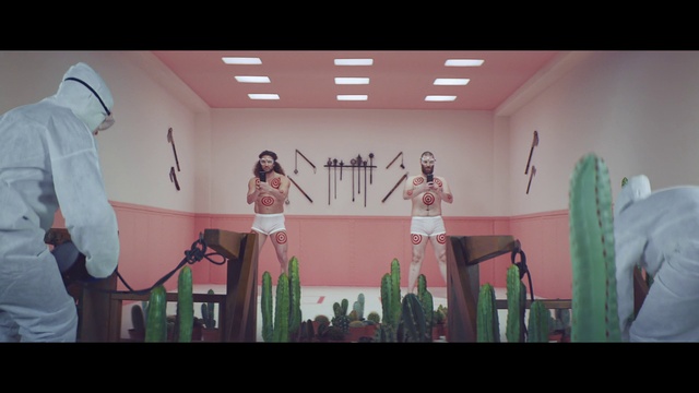 Video Reference: Green, Art, Standing, Font, Entertainment, Performing arts, Magenta, Fashion design, Painting, Event