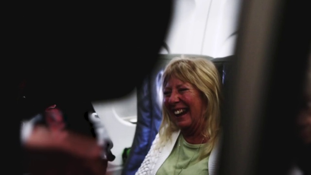 Video Reference: Smile, Fun, Event, Layered hair, Conversation, Luxury vehicle, Darkness, Room, Eyewear, Laugh