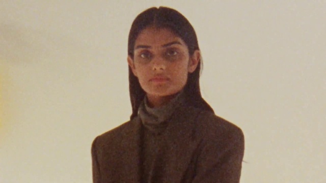 Video Reference: Forehead, Cheek, Coat, Sleeve, Gesture, Art, Blazer, Overcoat, Vintage clothing, Formal wear