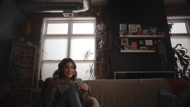 Video Reference: Window, Smile, Black, Comfort, Flash photography, Couch, Wood, Building, Tints and shades, Living room