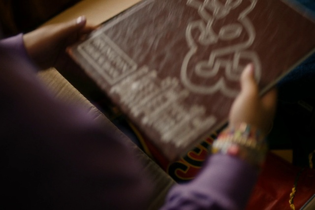 Video Reference: Hand, Sleeve, Gesture, Finger, Publication, Nail, Font, Wood, Pattern, Wrist