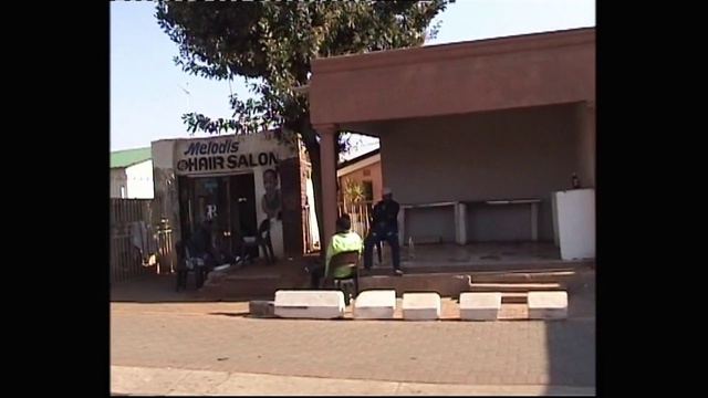 Video Reference: Sky, Shade, Tree, Facade, Building, Landscape, City, Leisure, Grass, Urban design